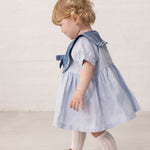 Baby short-sleeved dress with a fine sailor collar and bow at the front.