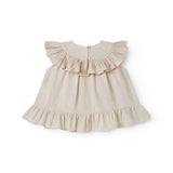 Ærmeløs beige top til baby med flæsedetaljer