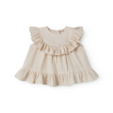 Ærmeløs beige top til baby med flæsedetaljer