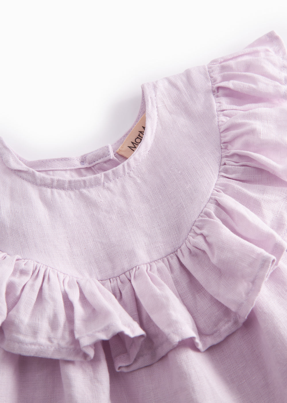 Ærmeløs lys lilla top til baby med flæsedetaljer