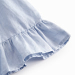 Ærmeløs top til baby med flæsedetaljer