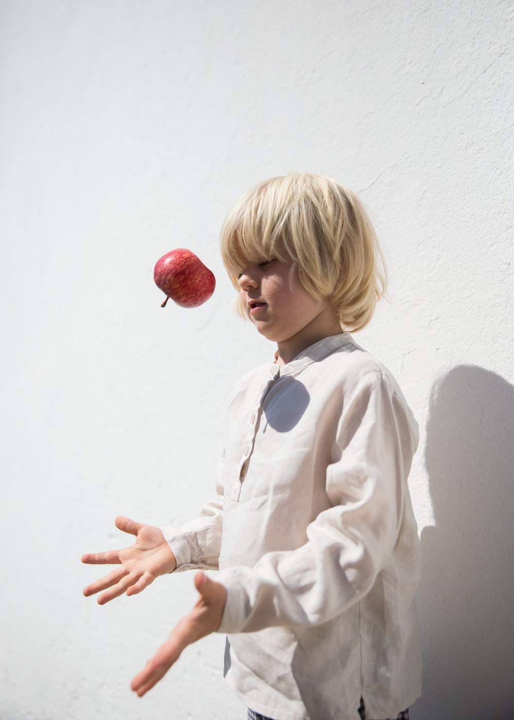 Child wearing a beige shirt with buttons
