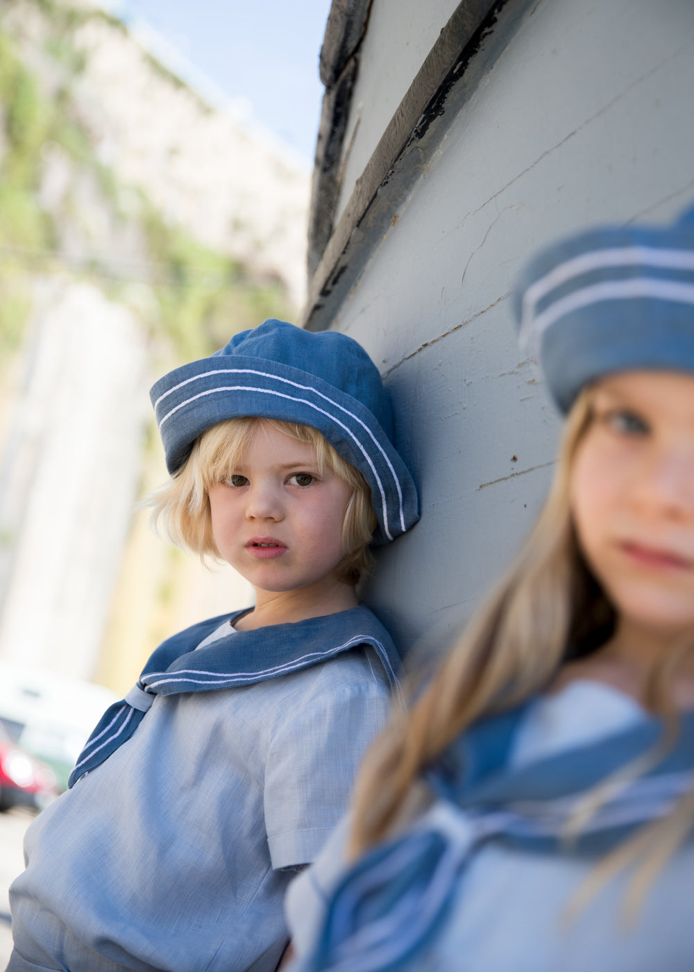 Children wearing matroshkas and sailor-inspired outfits.