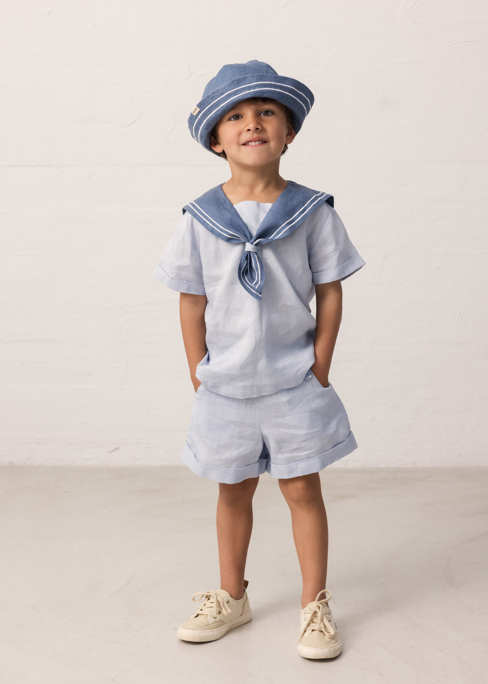 Children wearing matroshkas and inspired by sailor sets