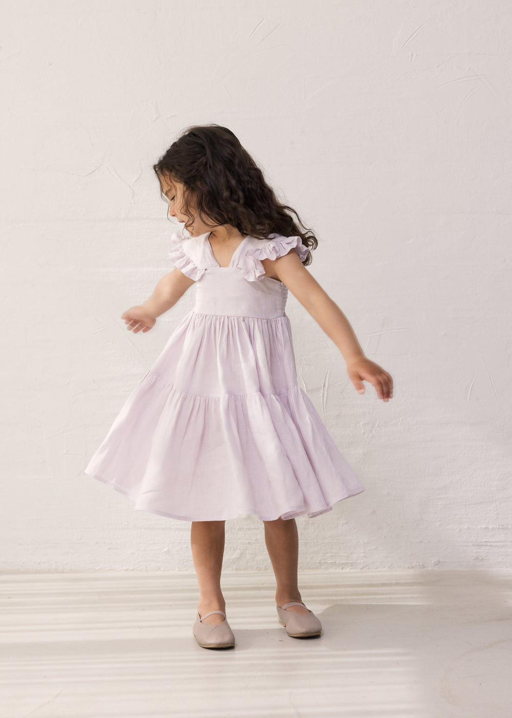 Wearing a sleeveless bright red dress.