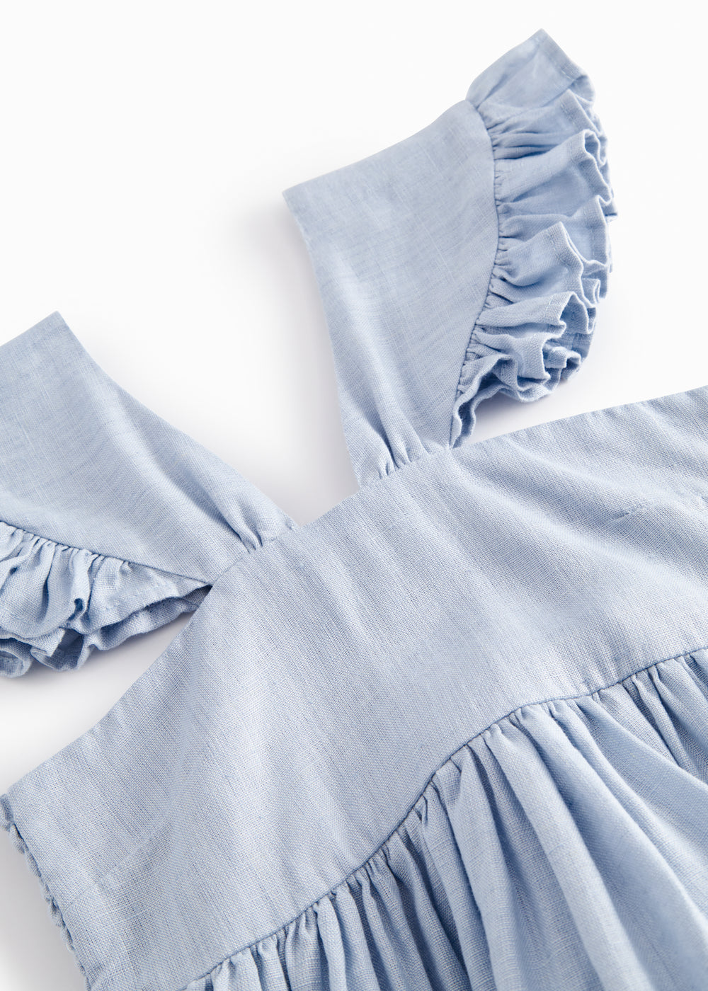 Ærmeløs kjole til børn med stropper og flæser på skulderen