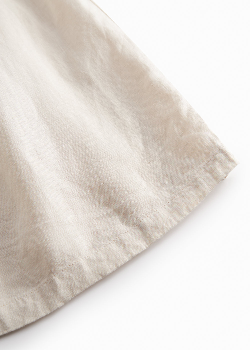 Beige hooded jacket for children with pockets and buttons.