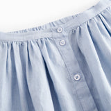 Lyseblå nederdel til børn med sidelommer og knapper
