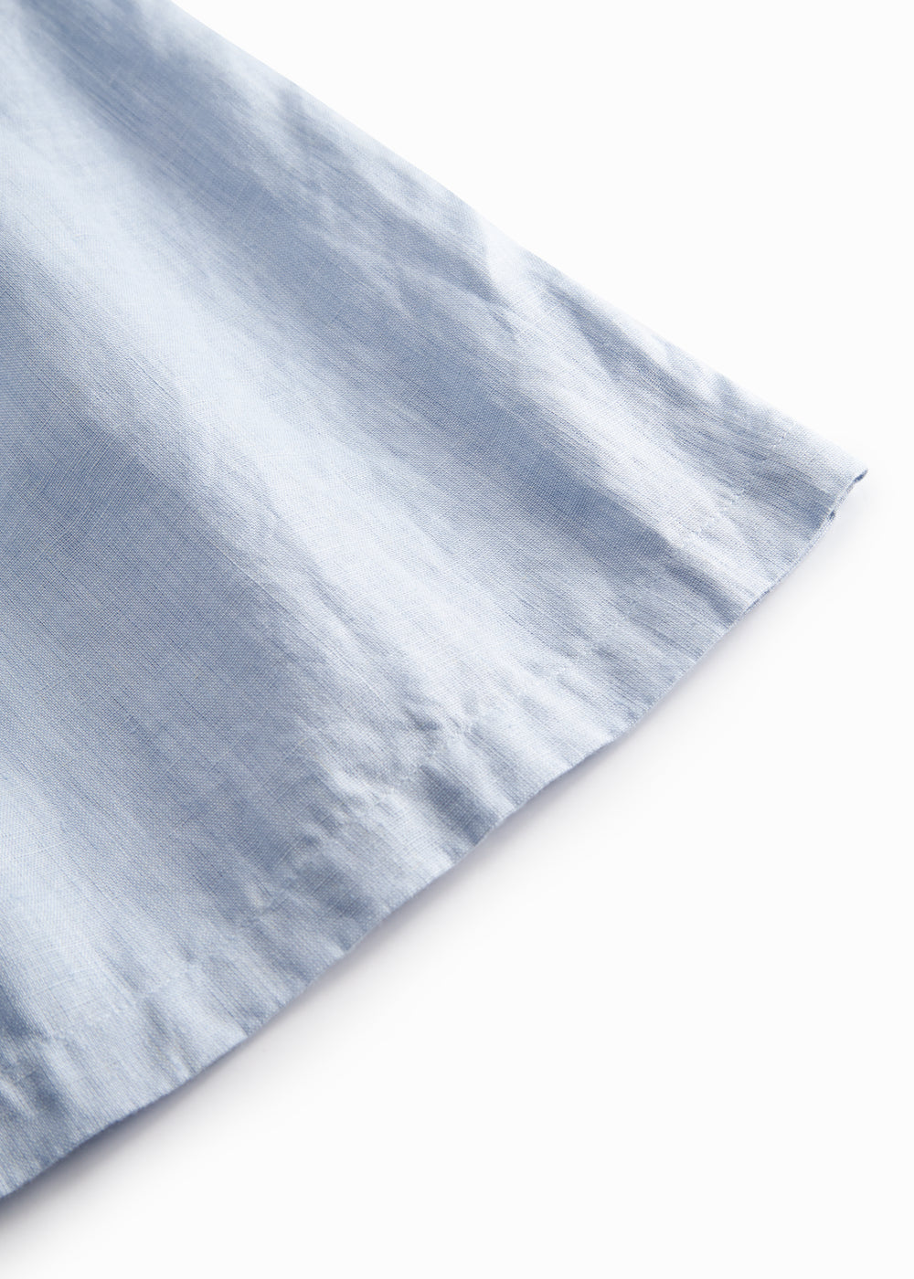 Lyseblå nederdel til børn med sidelommer og knapper