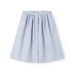 Light blue dress for children with side pockets and buttons.