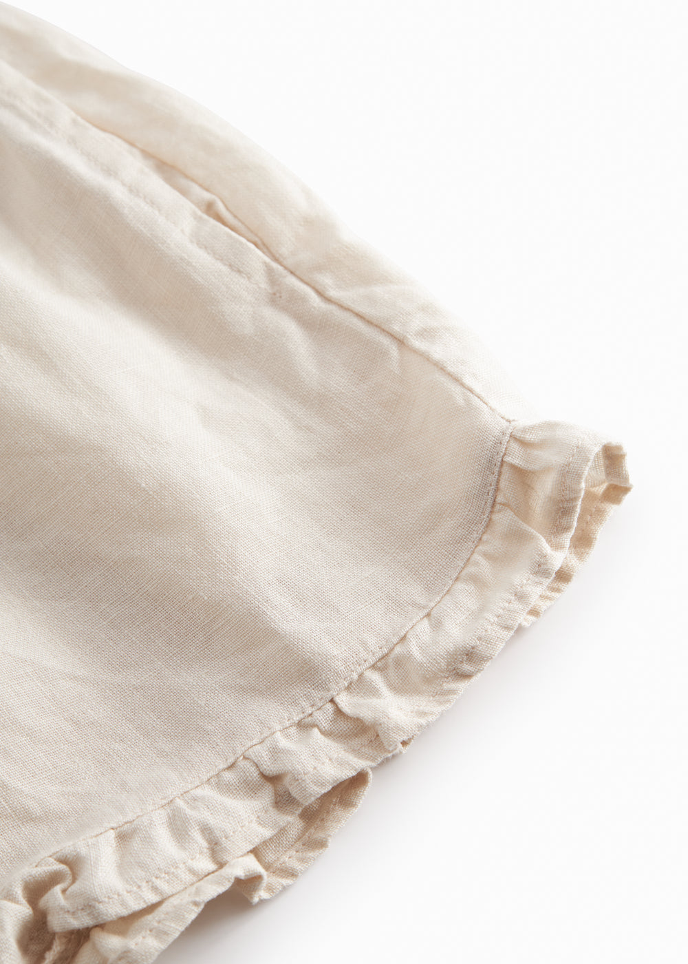 Beige shorts for children with pockets and side pockets.