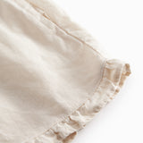 Beige shorts for children with pockets and side pockets.