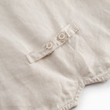 Beige vest for children with buttons and pockets