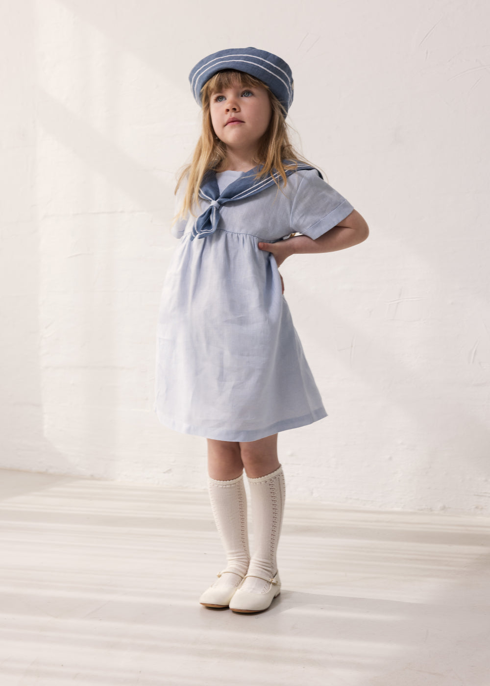 Pige-fitted matroshka and sailor-inspired dress
