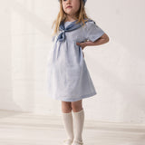 Pige-fitted matroshka and sailor-inspired dress