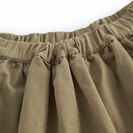 Green chino pants for children with a wide fit.