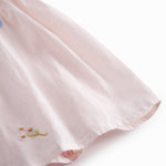 Short-sleeved baby dress with pretty floral embroidery, short sleeves, and collar.