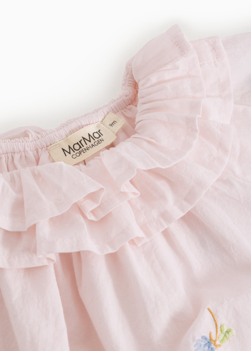 Baby dress with flower embroidery, short sleeves, and peter pan collar.