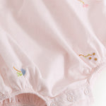 Baby dress with flower embroidery, short sleeves, and peter pan collar.