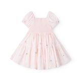 Red short-sleeved layered dress for children with a fine floral embroidery, puff sleeves, and smock effect.