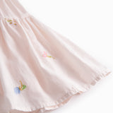 Red short-sleeved layered dress for children with a fine floral embroidery, puff sleeves, and smock effect.