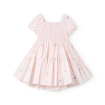 Red short-sleeved layered dress for children with a fine floral embroidery, puff sleeves, and smock effect.