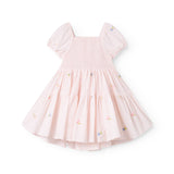 Red short-sleeved layered dress for children with a fine floral embroidery, puff sleeves, and smock effect.