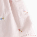 Red dress with small embroidery and puffed sleeves for children.