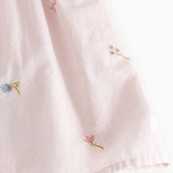 Red dress with small embroidery and puffed sleeves for children.