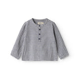 Fitted turtleneck baby shirt with a front closure