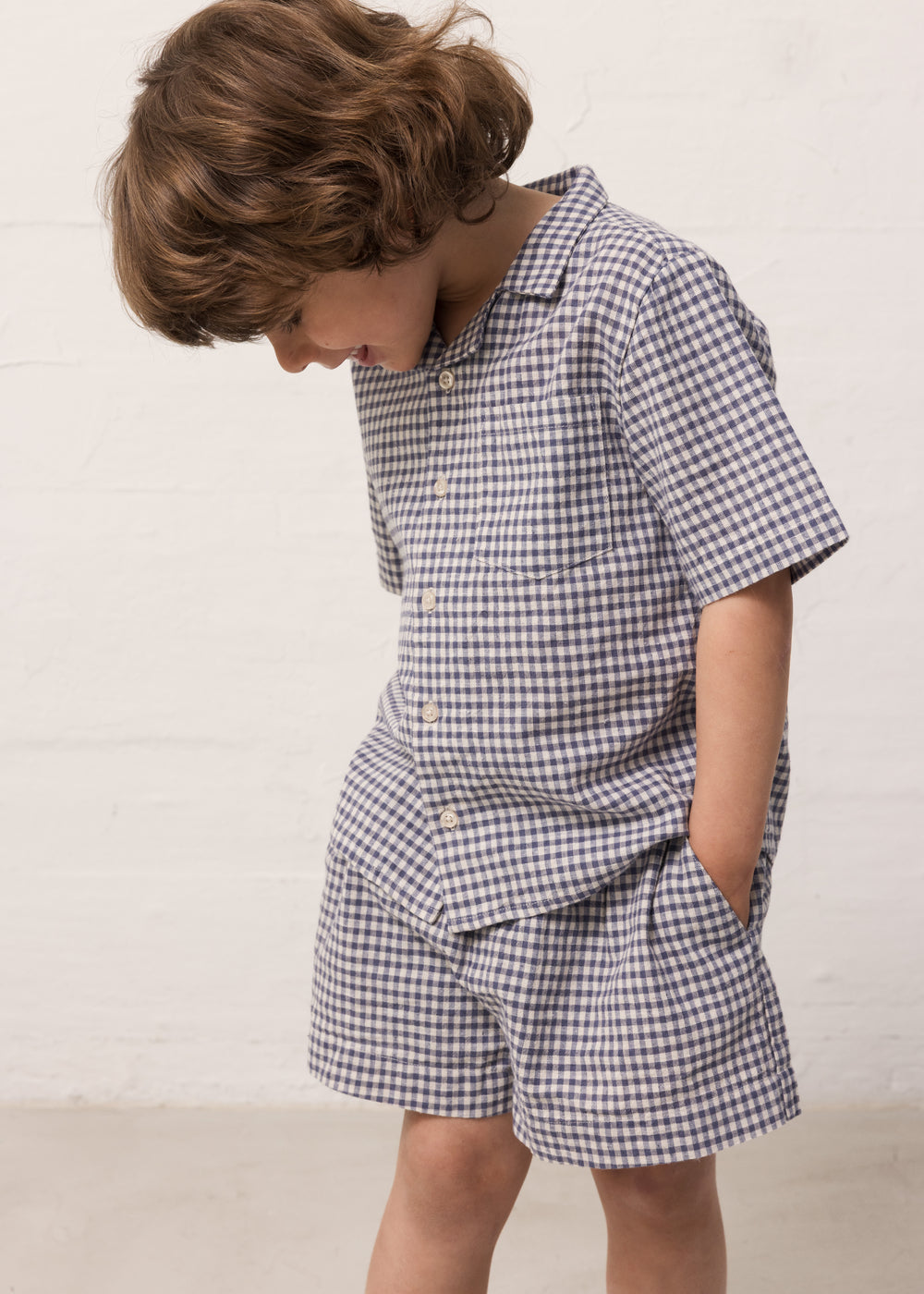 Children wearing a t-shirt and shorts.
