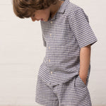 Children wearing a t-shirt and matching shorts.