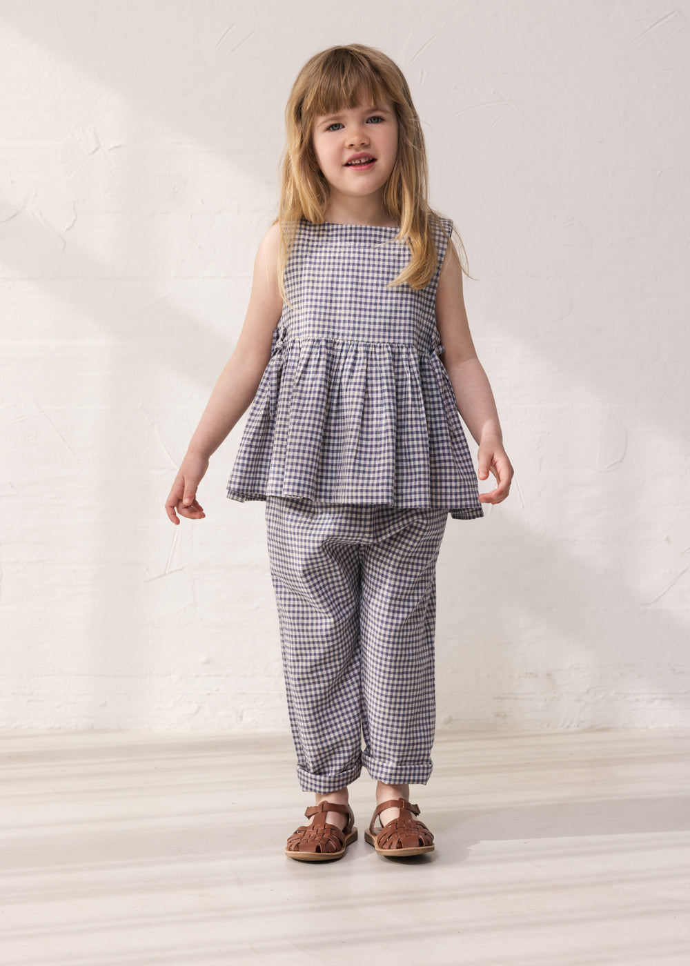 Wearing a net top and matching pants.