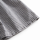 Sort and white nettedrop-down jacket for children with flaps on the shoulder straps.