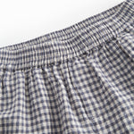 Sort og hvid ternet shorts til børn med sidelommer, elastik i livet og lomme bagpå