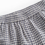 Sort og hvid ternet shorts til børn med sidelommer, elastik i livet og lomme bagpå