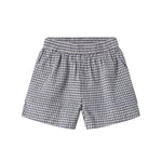 Sort and white net shorts for children with side pockets, elastic in the waist, and a pocket at the back.