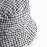 Internet-safe and white bobble hat for children.