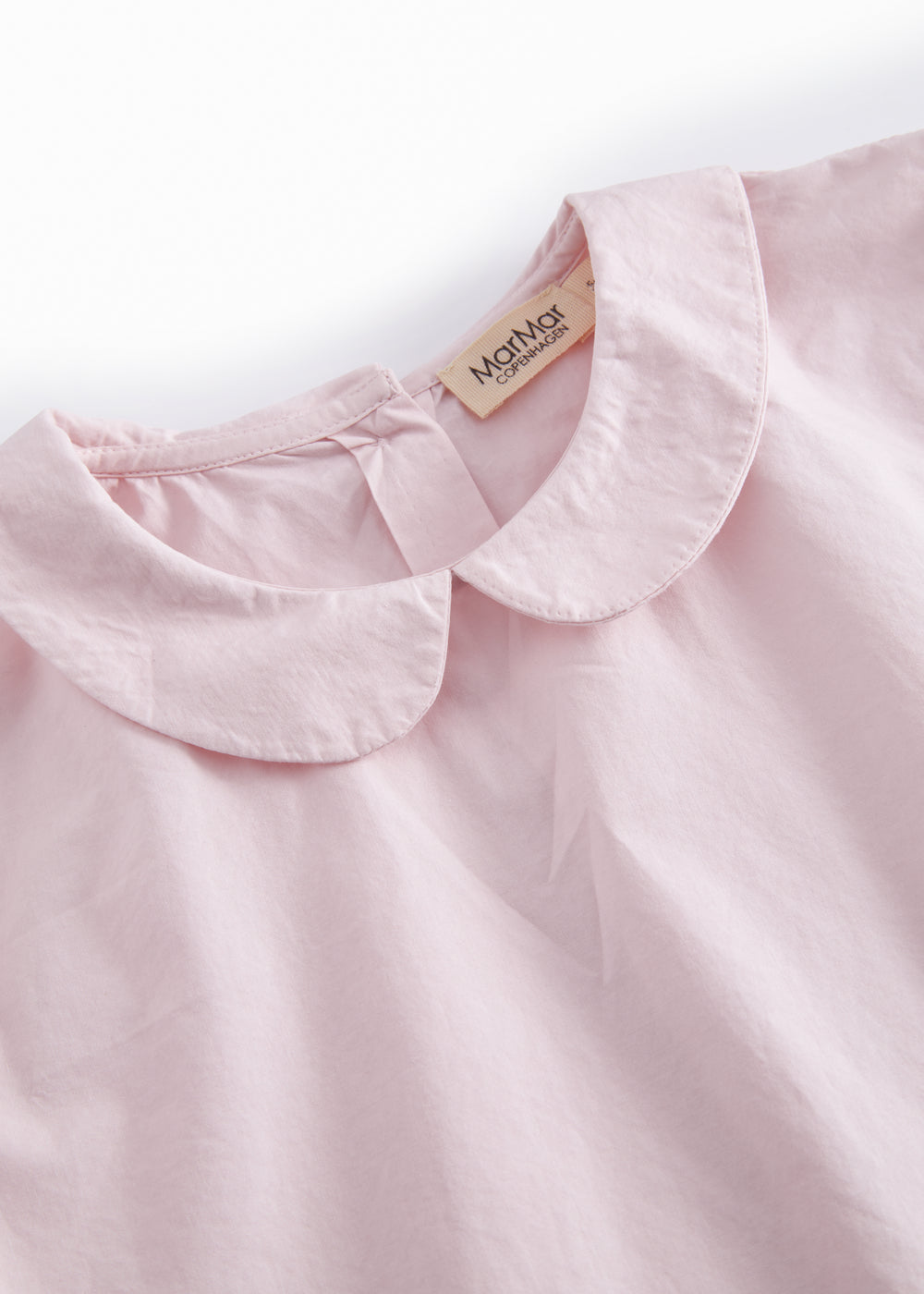 Lyserød børnebluse med krave og lange ærmer