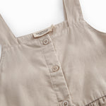 Gray sleeveless dress for children with wide stripes, buttons, and pockets.