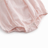 Red baby onesie with long sleeves and a peter pan collar.