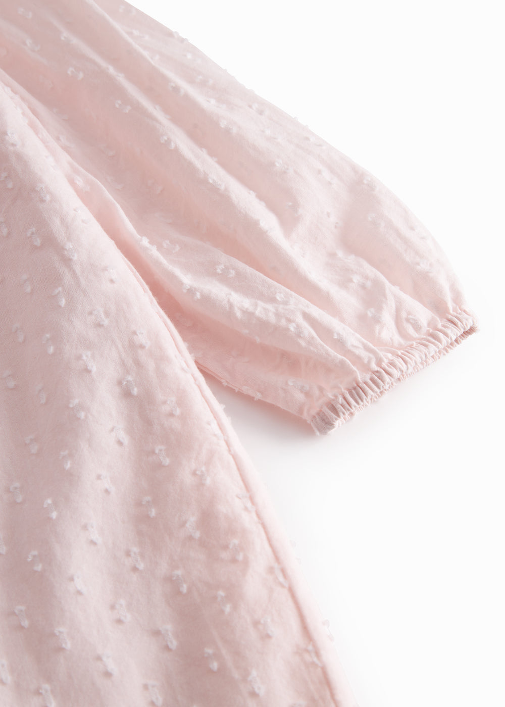 Red children's dress with long sleeves and ruffled collar.