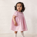 Baby pigeons in yellow short-sleeved dresses with fine stripes and picot edges.