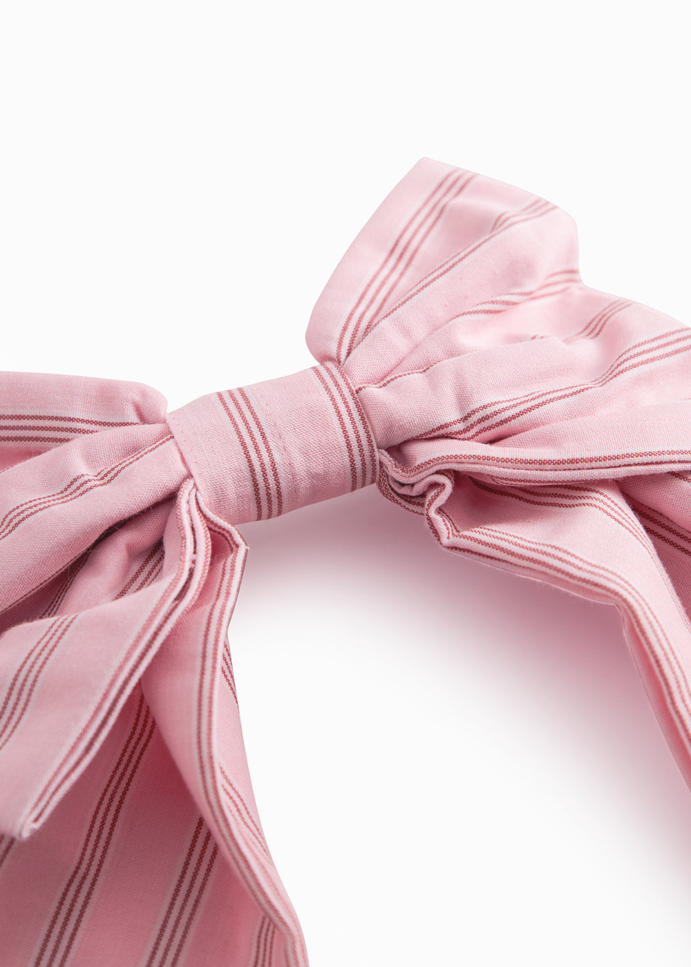 Lyserød sløjfespænde til håret med fine striber