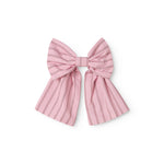 Red bow tie for hair with fine stripes.