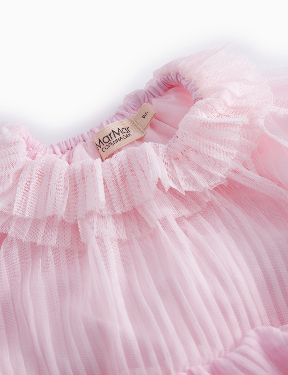 Red long-sleeved baby dress in pleated tulle with multiple layers.