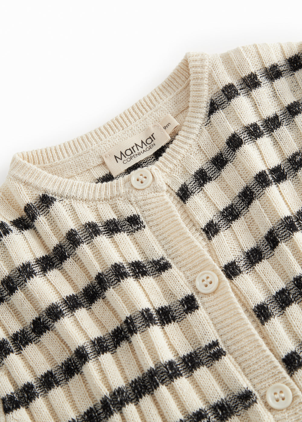 Striped baby cardigan with round neck, stripes, and button closure.