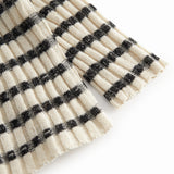 Striped baby cardigan with round neck, stripes, and button closure.