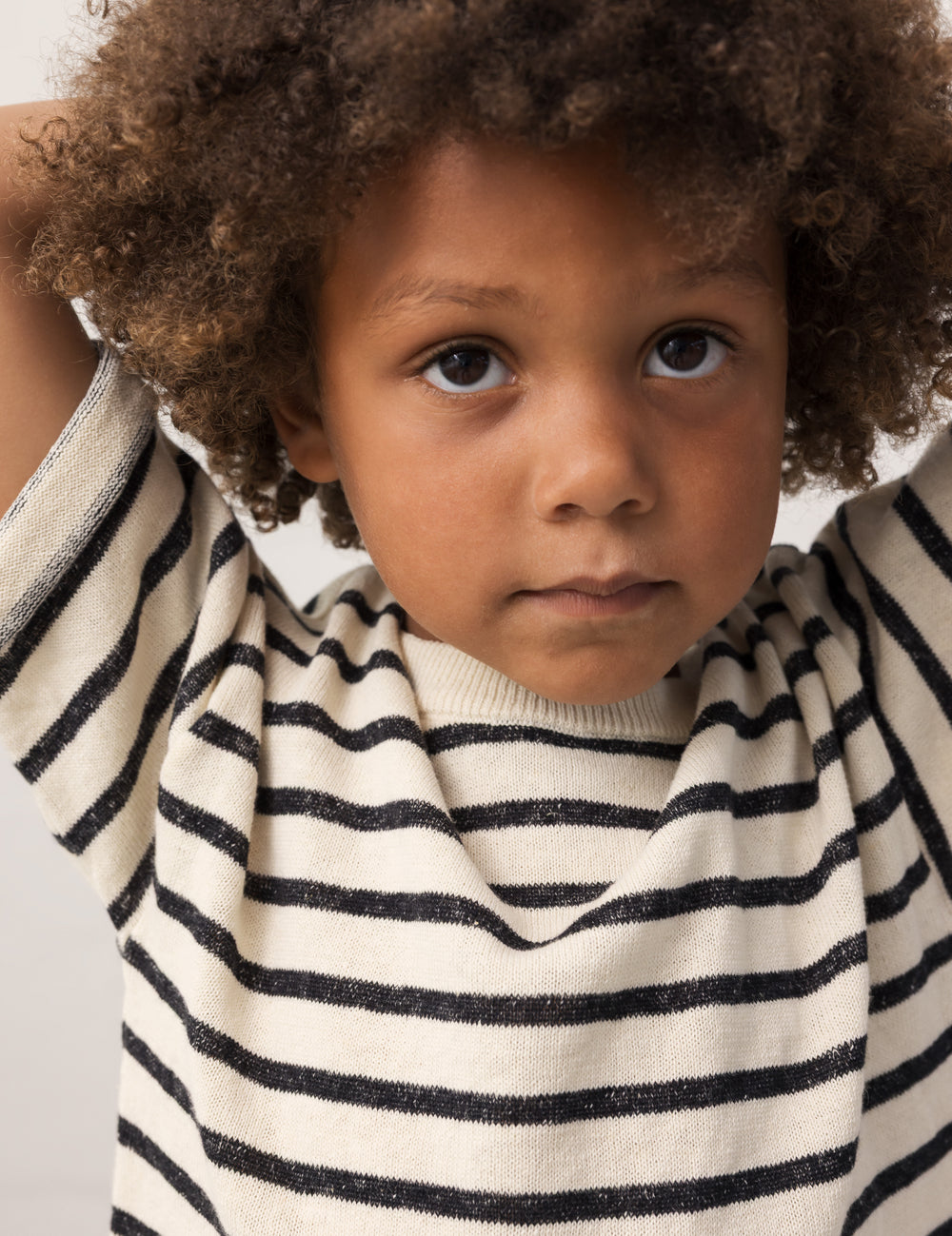 Children wearing striped shirts