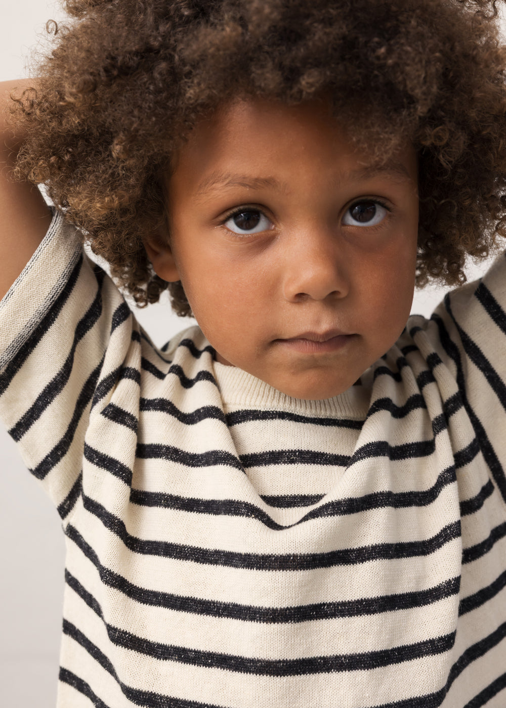 Children wearing striped shirts